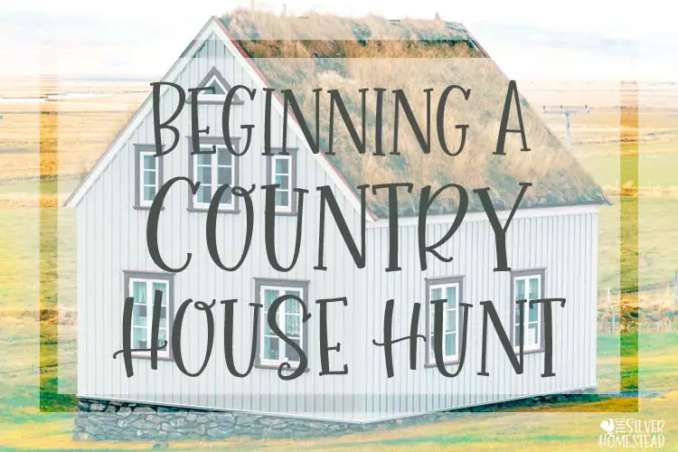 A white shiplap farm house surrounded by hay fields in the country beginning a country house hunt